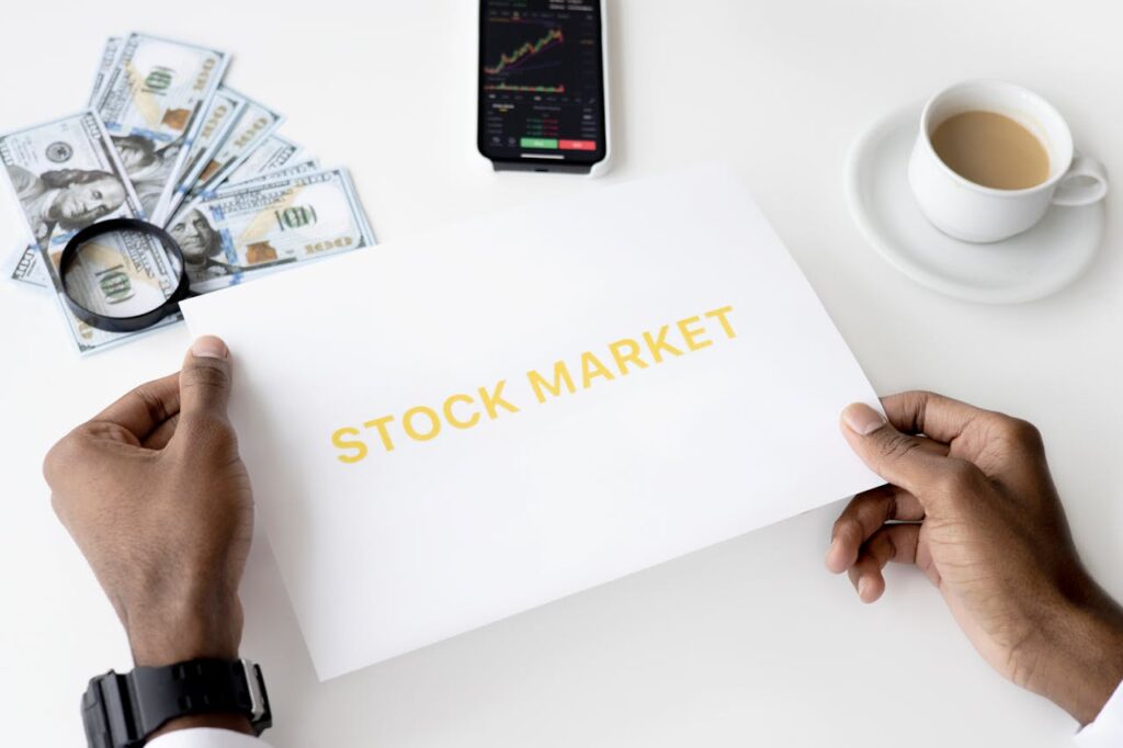 Stocks For beginners: Stock market analysis with financial charts, money, and coffee on a desk 